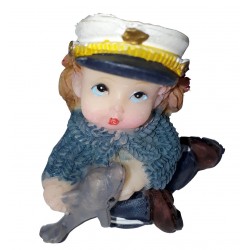 Figurine miniature 1 fillette habillée en marin jouant avec un petit dauphin